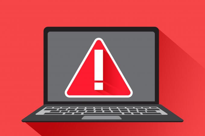 Laptop with a red background indicating a warning